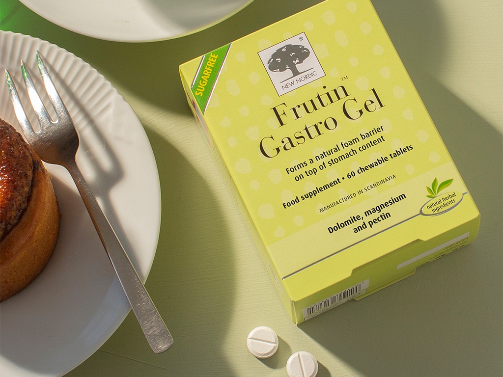 Frutin GastroGel packaging with tablets and pastry