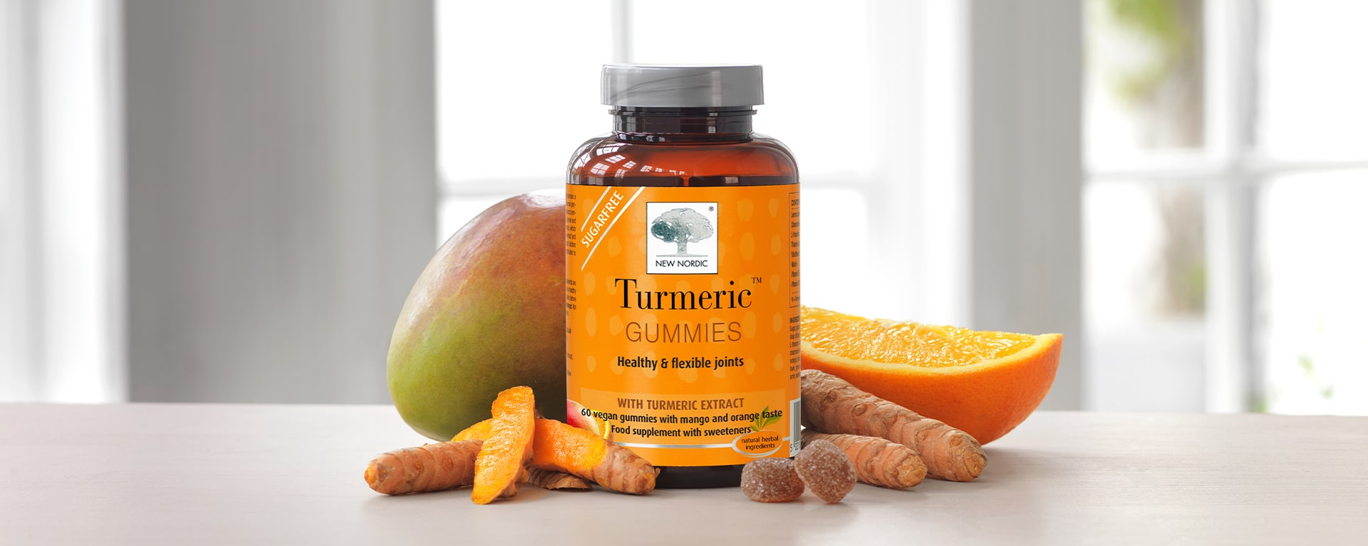 Turmeric™ Gummies jar surrounded by ingredients